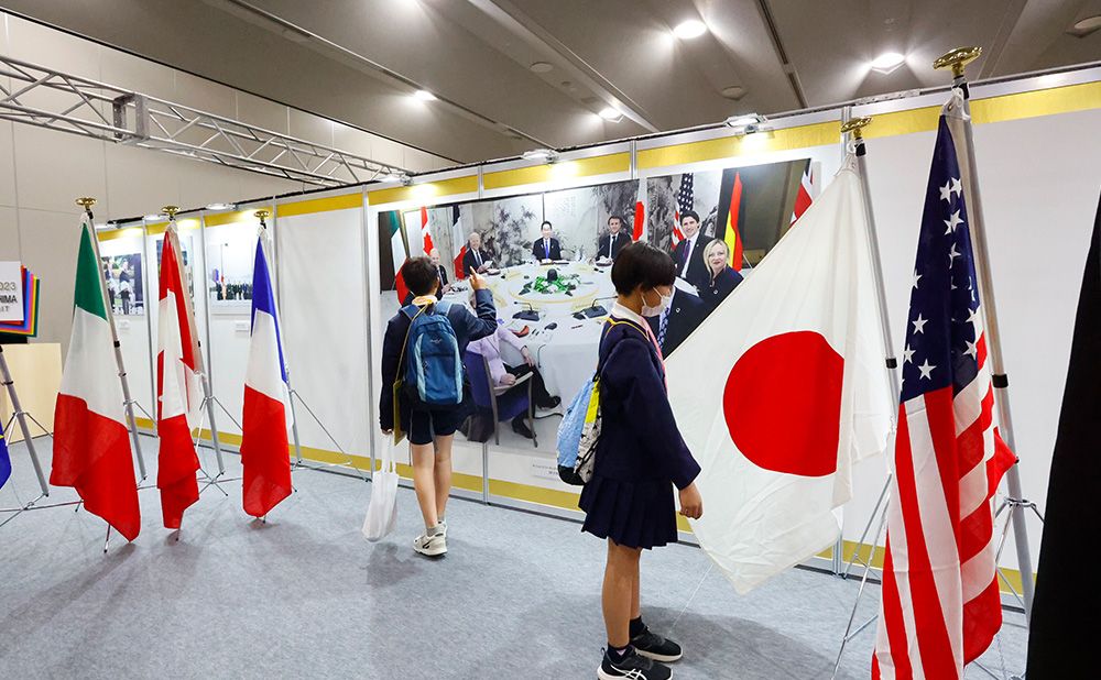 Children observe a display of national flags