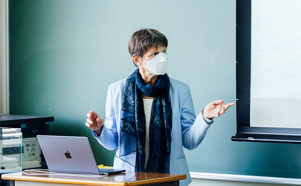 Funck standing on the podium to give a lecture