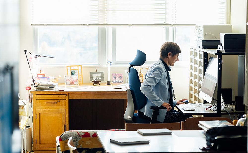 Funck staring at her computer in the lab